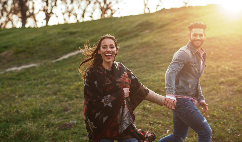 Couple in love enjoying a walk on a sunny spring day.