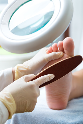 Woman receiving podiatry treatment in a Day Spa